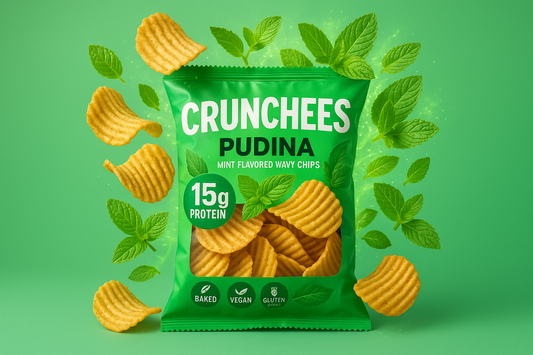 Pudina Flavoured Pack of crunchy, wavy chips named crunchees. Show some crips out of the pack, some in the pack, a proper blast of pudina flavour(mint) and crunch. Highlight "15G protien", "baked", "vegan" and "gluten free" on the pack